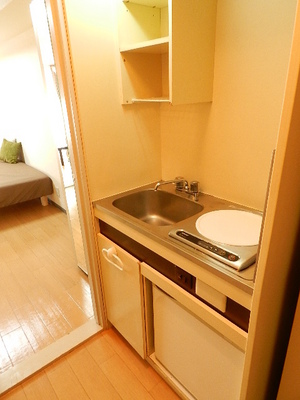 Kitchen. A small kitchen Mini fridge IH stove with 1-neck