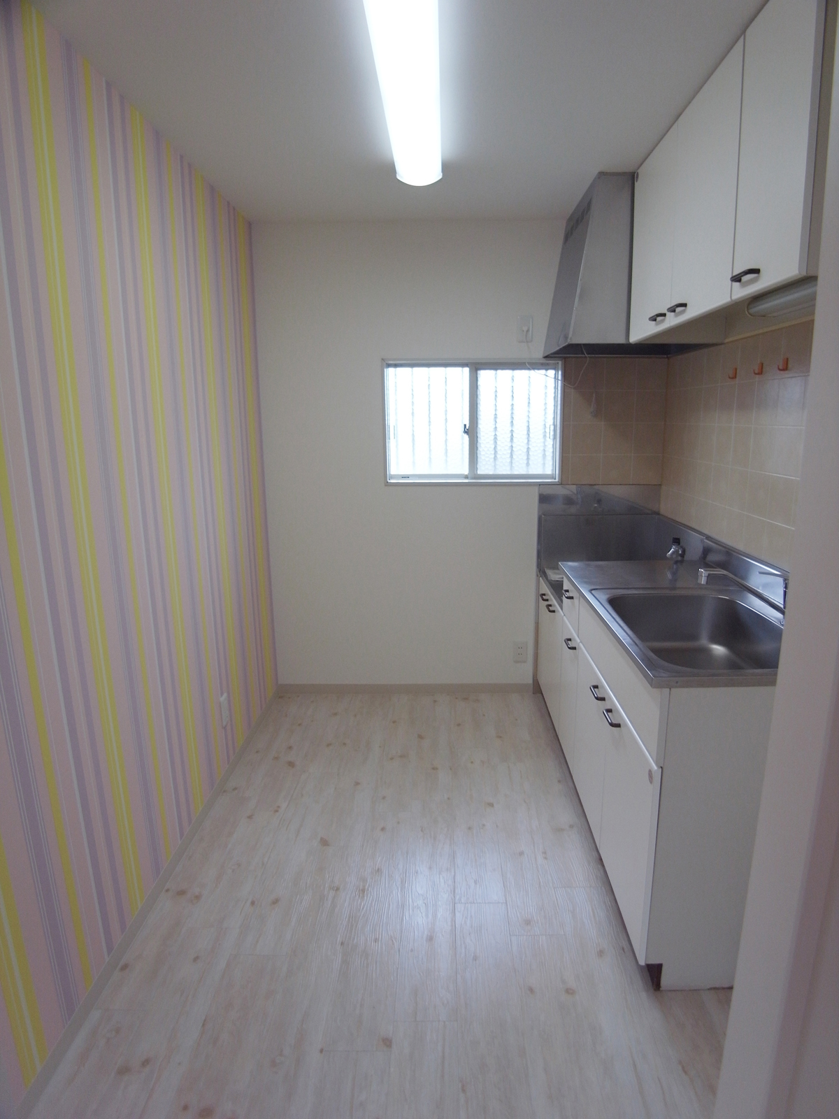 Kitchen. Bright and there is a window kitchen