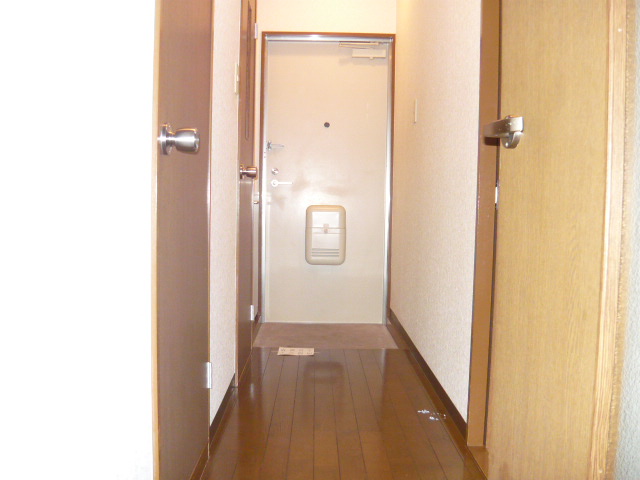 Other room space. Hallway from the living room to the door