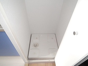 Other room space. Washing machine in the room