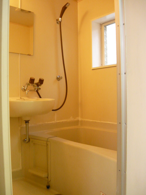 Bath. There is a window in the bath. This basin ball and integrated bathroom.