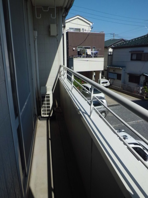 Balcony. Day is good because it is on-site parking is before building.