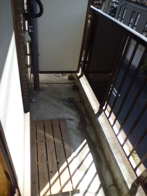Balcony. Veranda. Washing machine storage is here.