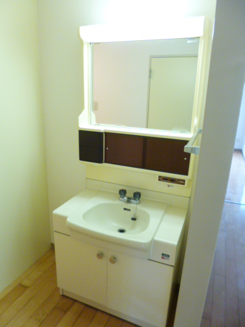 Washroom. It is also equipped with a washbasin