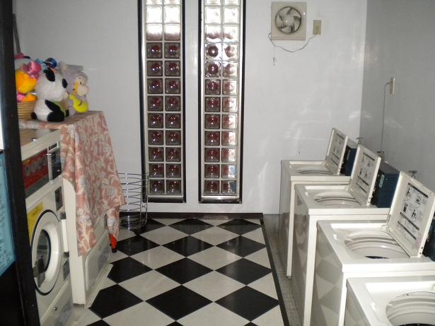 Other Equipment. Coin-operated laundry machines installed on the first floor