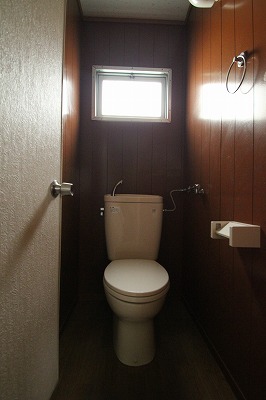 Toilet. It is a photograph of the same type of room.