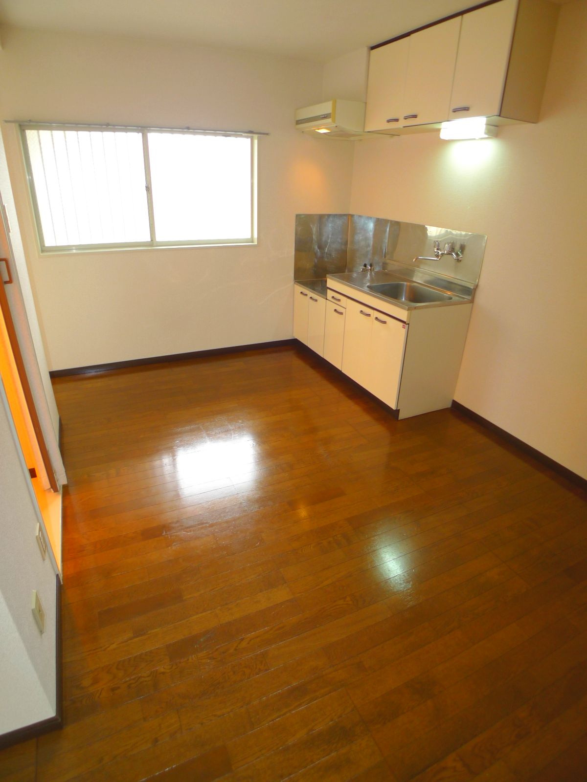Living and room. There is a window in the kitchen