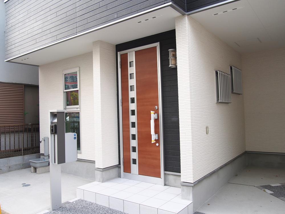 Entrance. The bicycle parking space marked with standing water