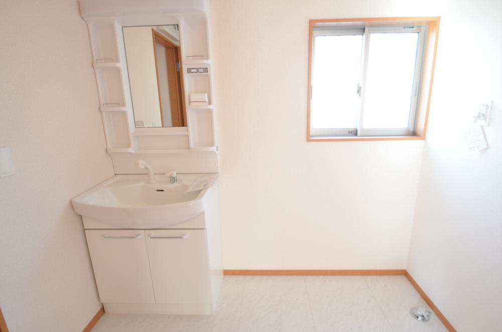 Wash basin, toilet. Washroom