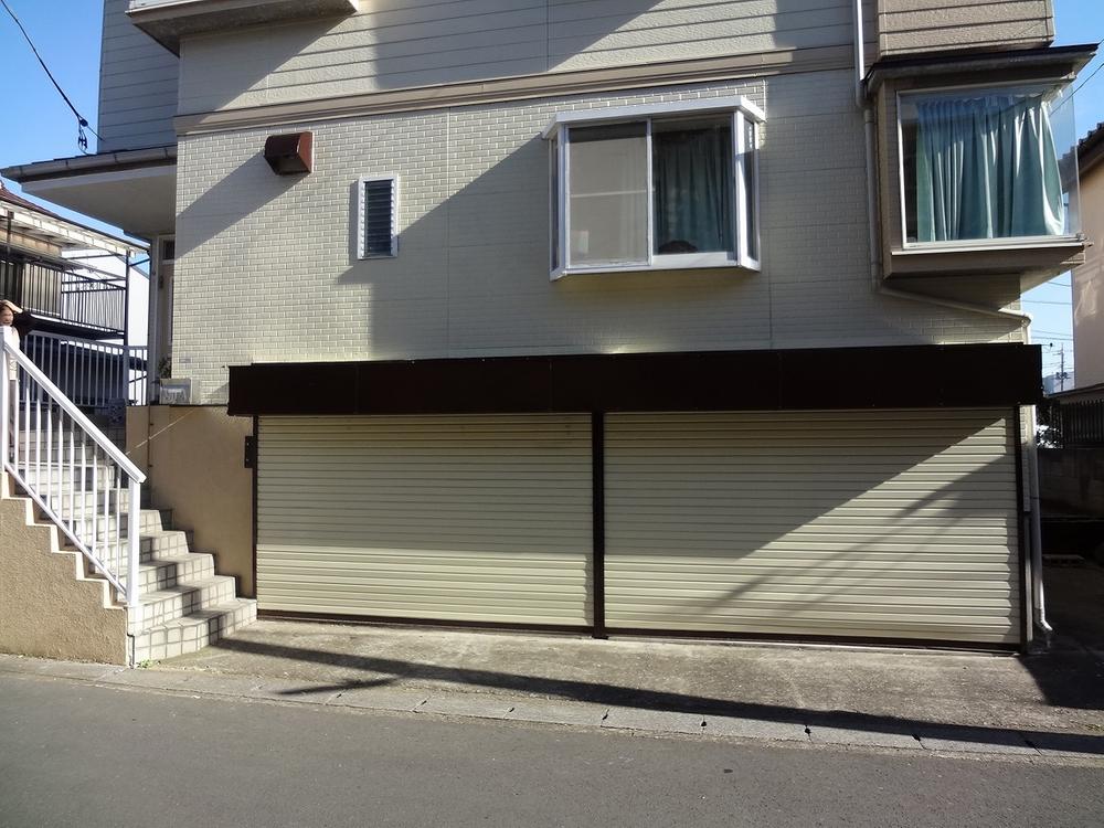 Parking lot. Built-in garage with electric shutter