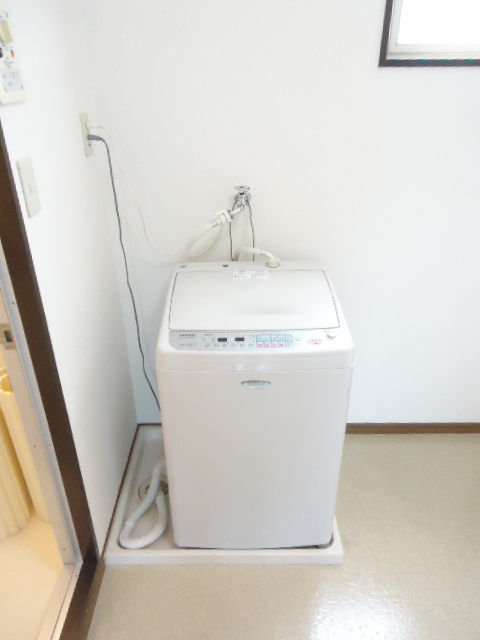 Washroom. It is indoor washing machine Storage