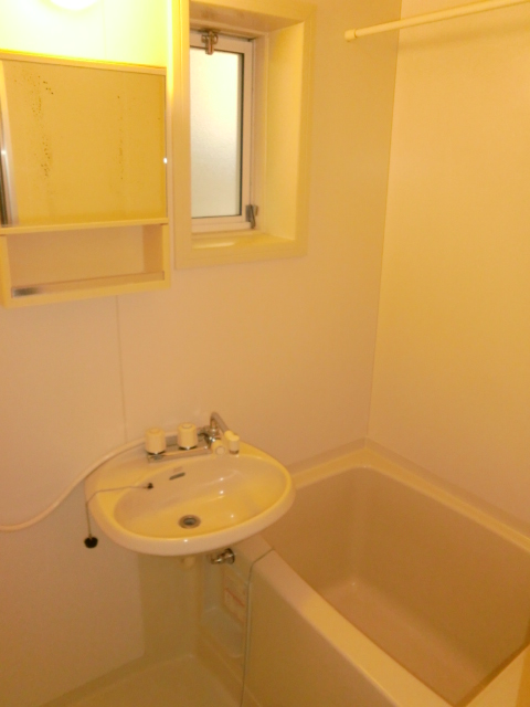 Bath. Bright bathroom with a small window