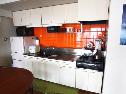 Non-living room. Kitchen with orange tiles is eye-catching