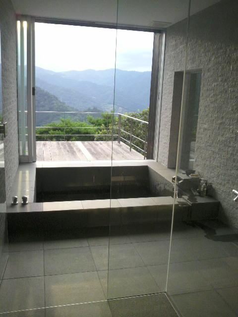 Bathroom. With natural hot spring: stone paste of large bathtub The open-air bath in the window fully open