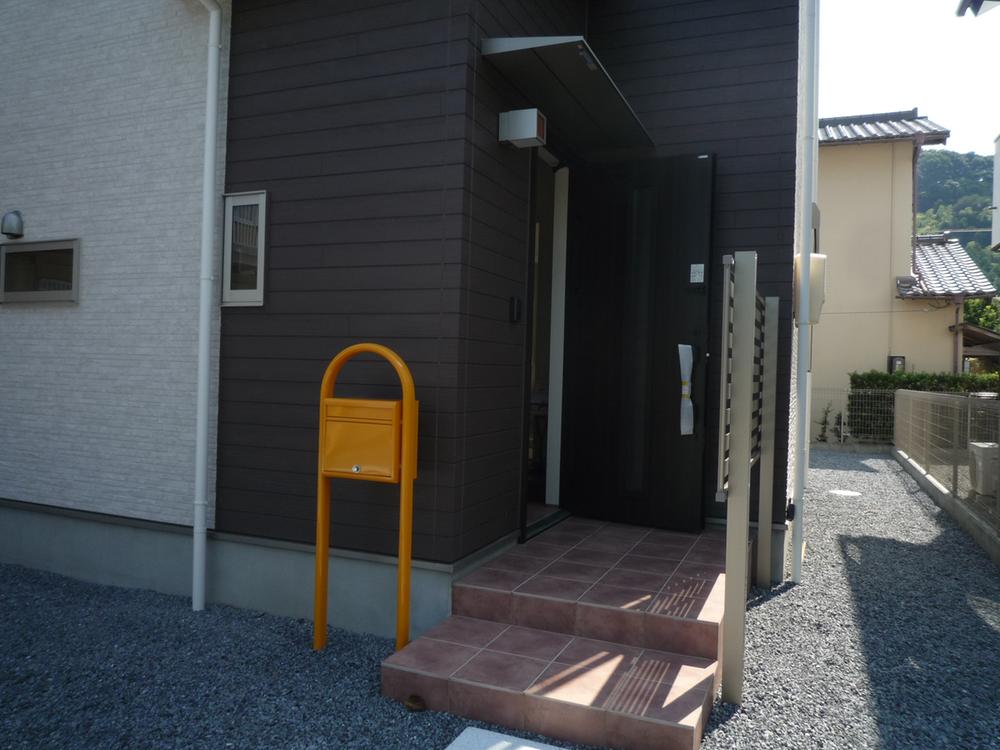 Garden. Entrance yellow post is the mark