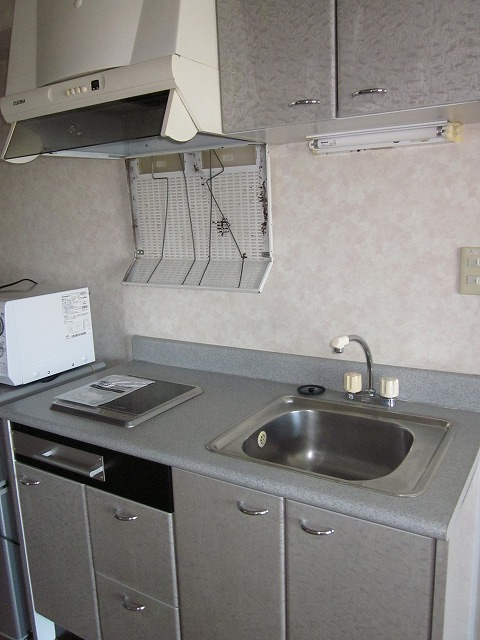 Kitchen. It comes with a hanging cupboard and stove!