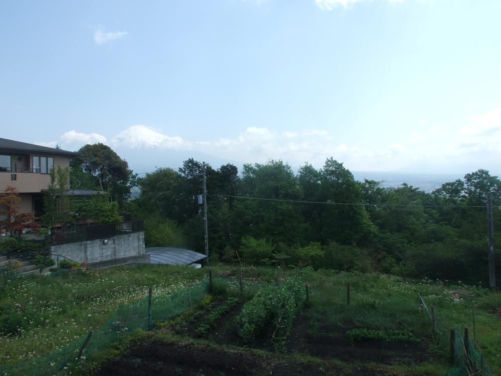 Local land photo. Mount Fuji is visible to the left of slightly above the middle photo