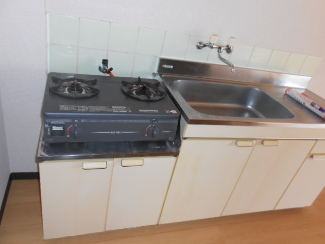 Kitchen. It is with a gas stove.