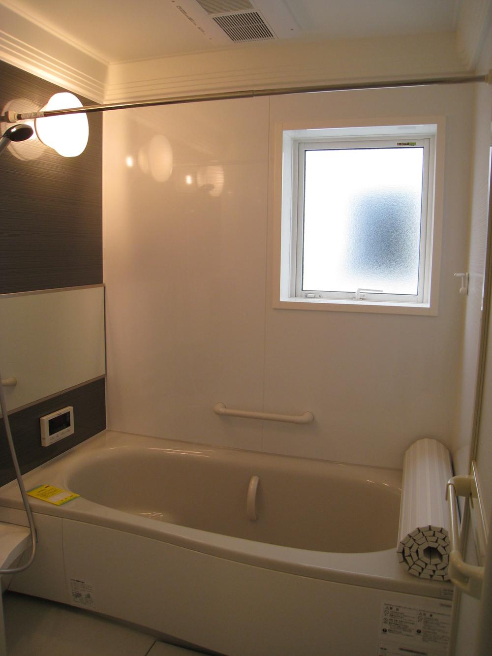 Bathroom. Building C. Bathroom wood panel to settle accented. 