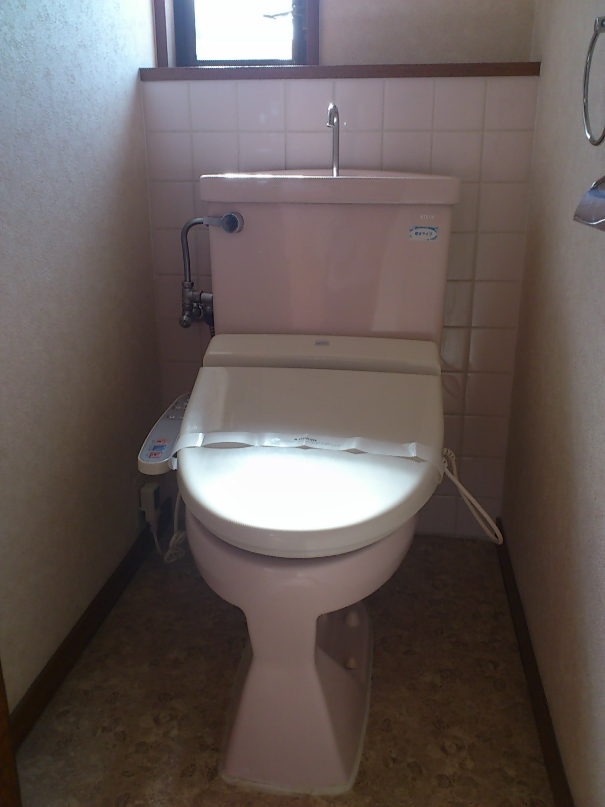 Toilet. Attach hot water cleaning toilet seat on arrival
