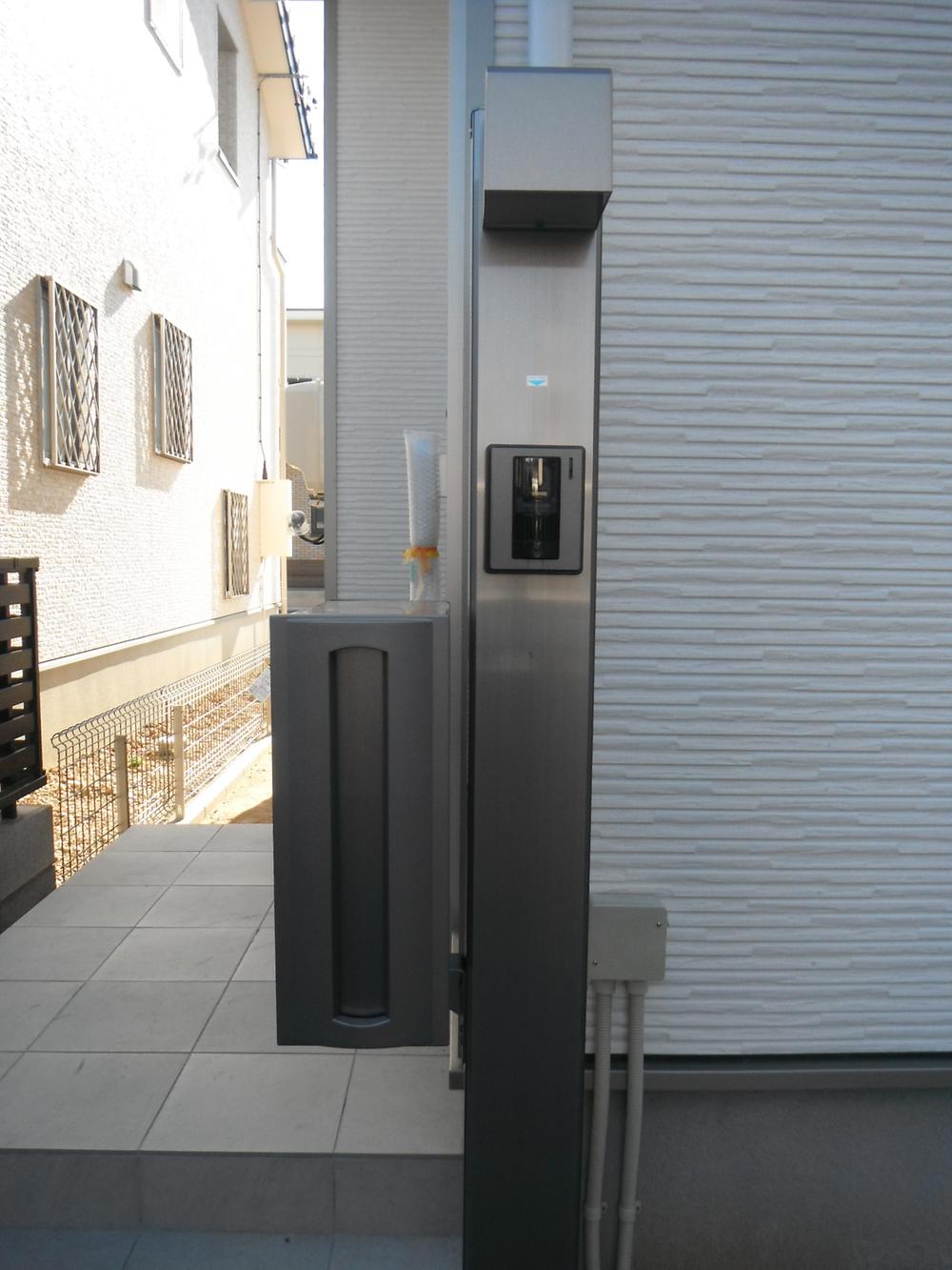 Rendering (appearance). Gatepost with a TV monitor with intercom & Post (Completion is an image)