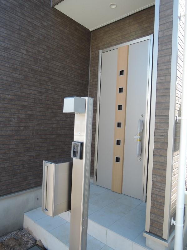 Entrance. Entrance with eaves, Intercom with a camera, Post construction already