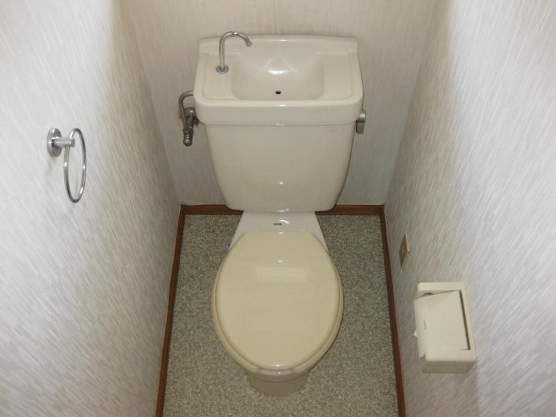 Toilet. There is a window in the toilet.