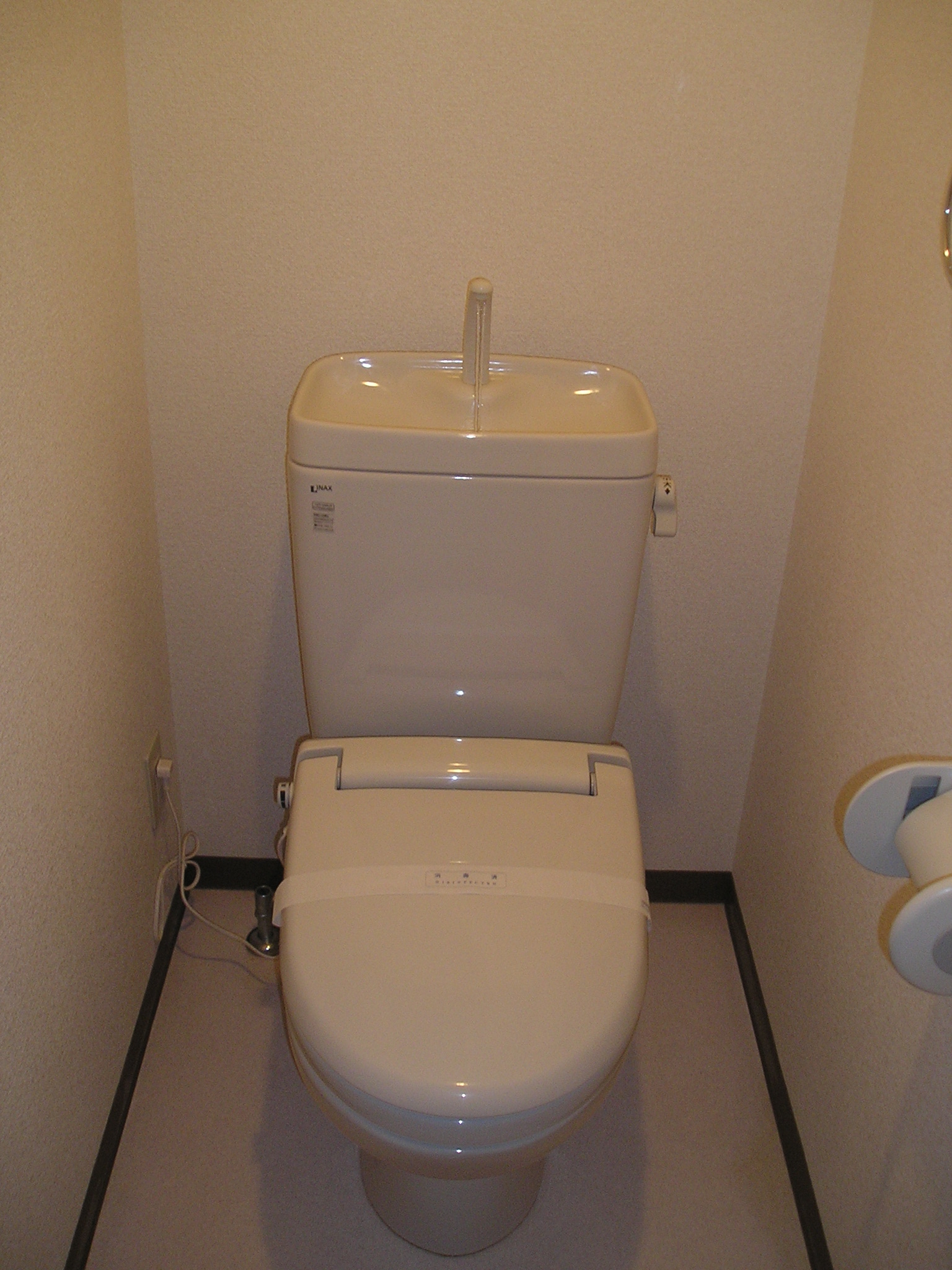 Toilet. A heated toilet seat