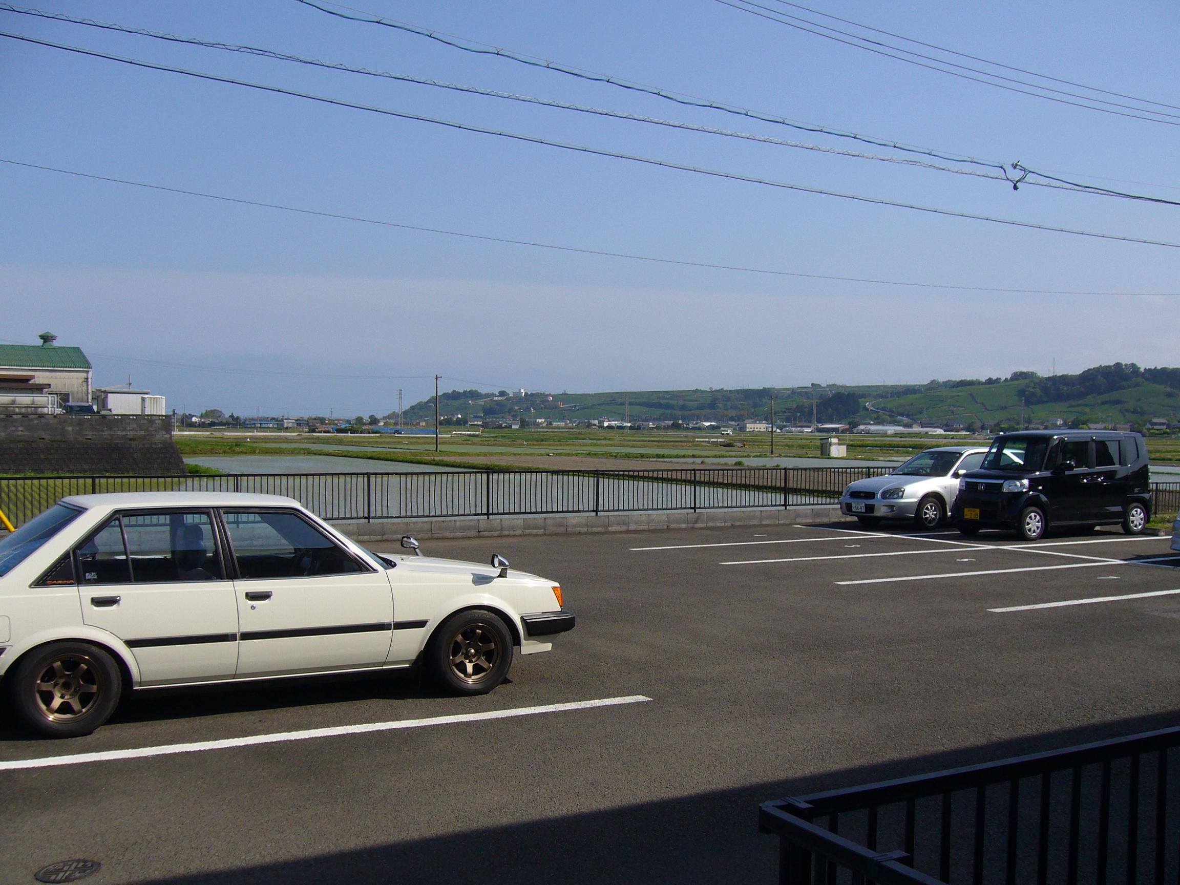 Parking lot. South Parking, Countryside Beyond that is followed by a rice field and field