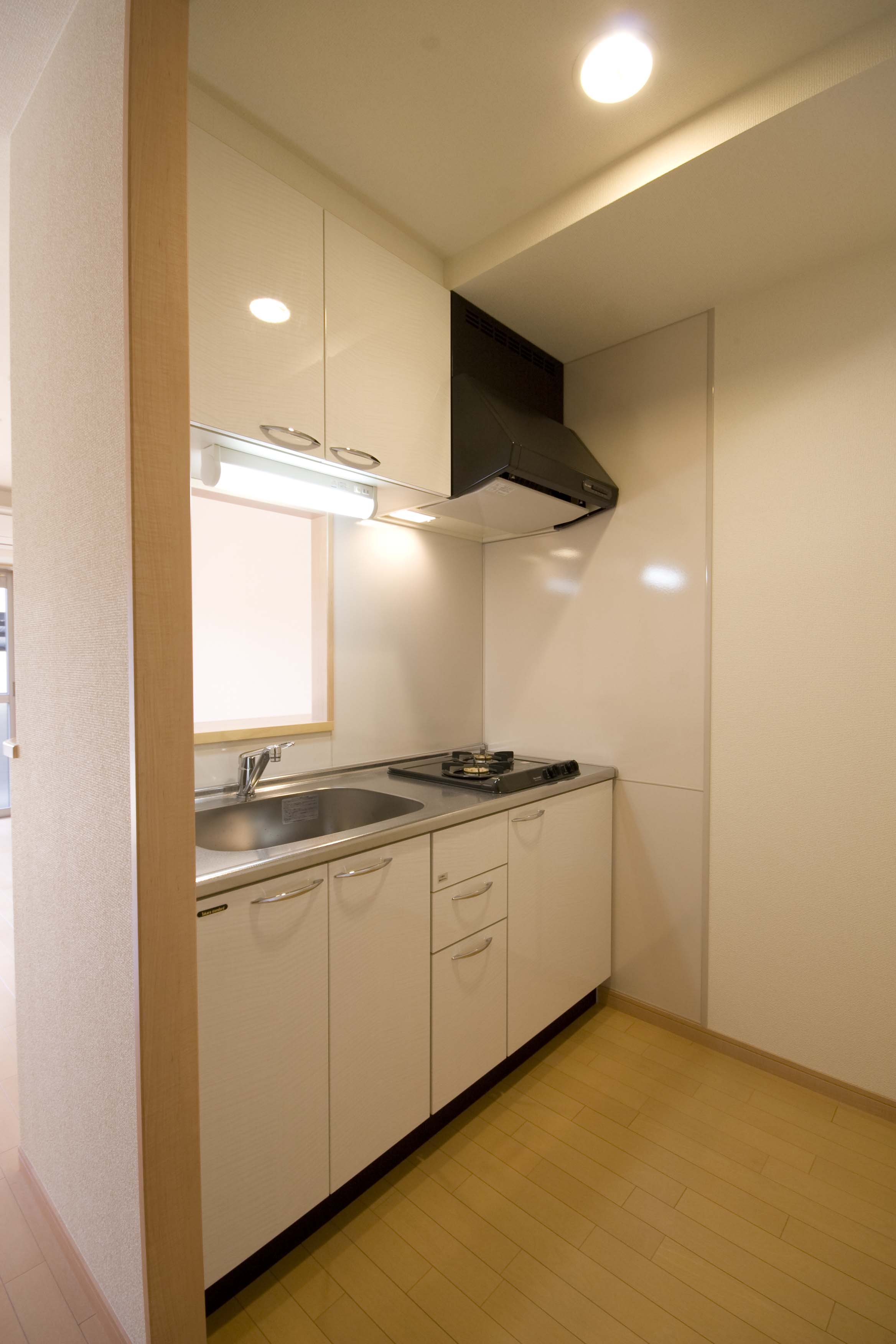 Kitchen. Two-burner stove ・ Hanging cupboard ・ Hand lighting kitchen