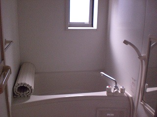 Bath. There is a window in the bathroom.