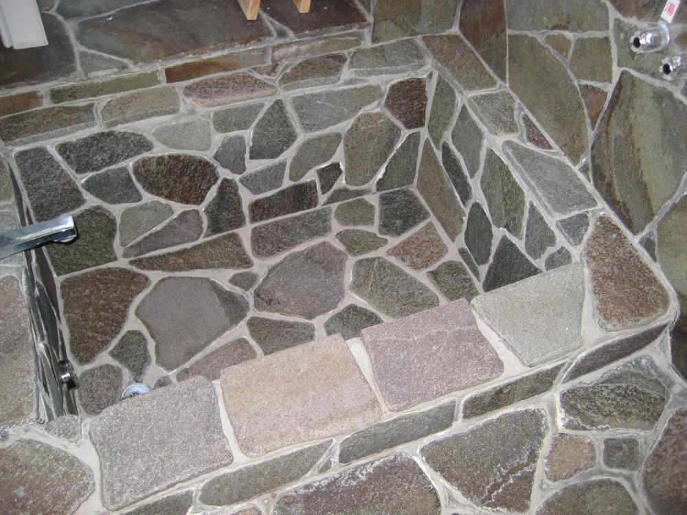 Bathroom. Stone-clad bathtub