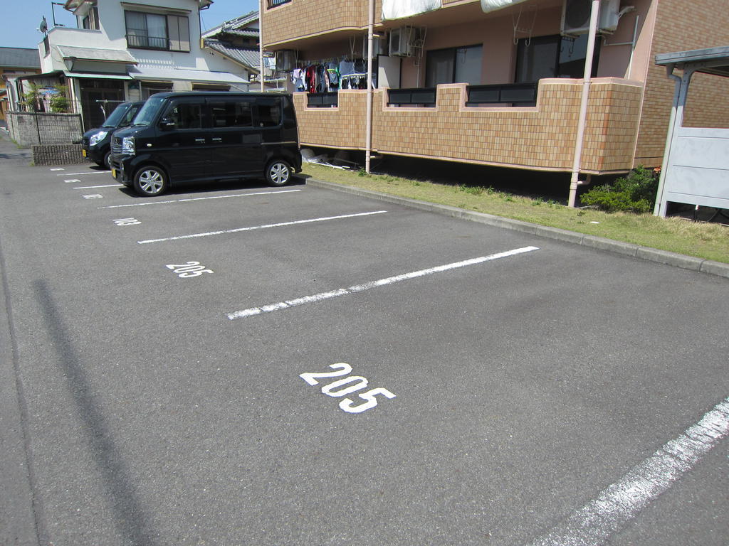 Parking lot. It is two parallel in the front of the room.