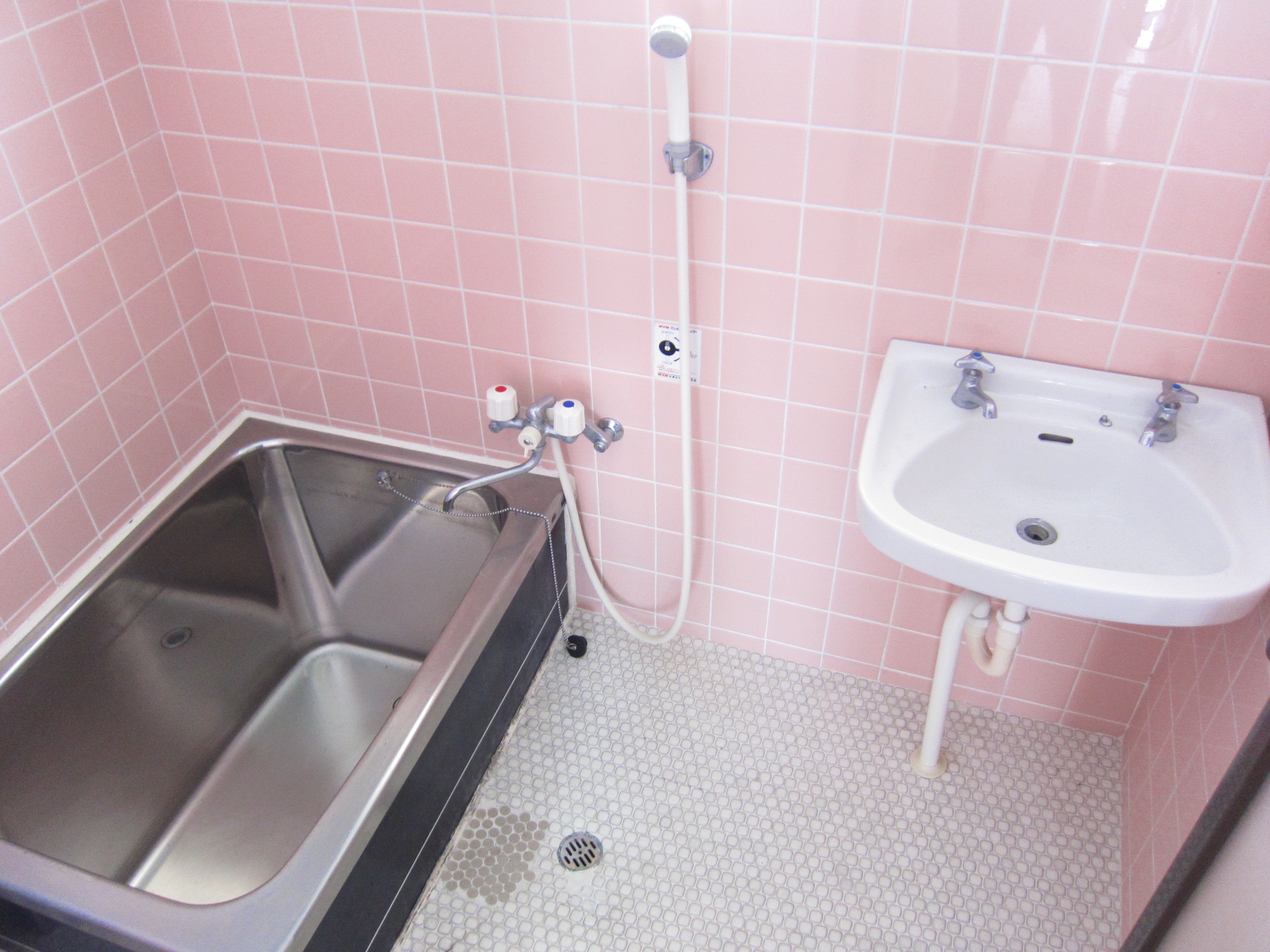 Washroom. Wash basin is located in the bathroom.