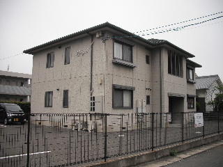 Building appearance. Parking space is equipped on the east side.