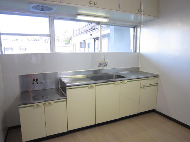 Kitchen. Large is a sink that is suitable for cooking.