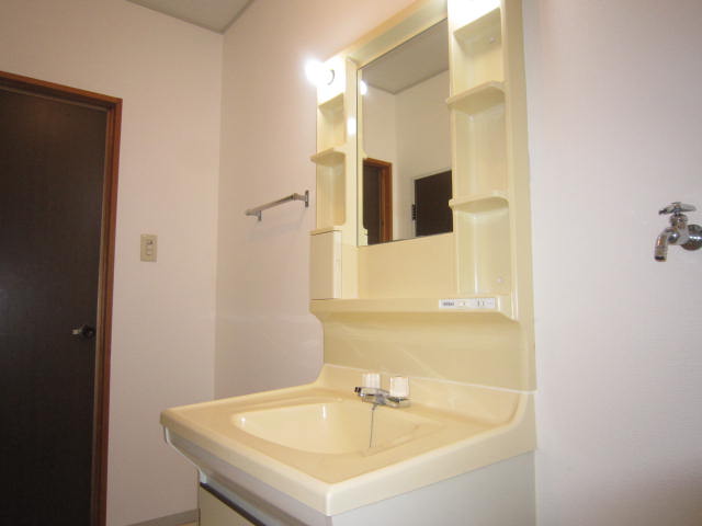 Washroom. Bathroom vanity Washing machine can be installed in a room.