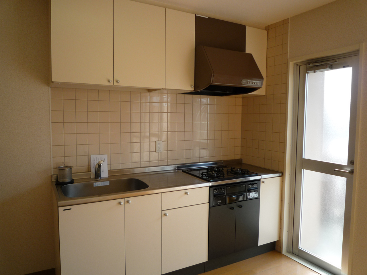 Kitchen. It goes out to the balcony from the kitchen. Drop-in with stove