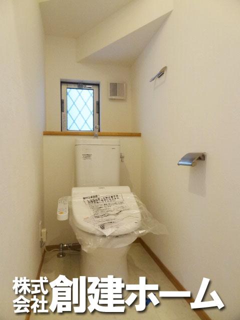 Toilet. There is also a window, Clean toilet