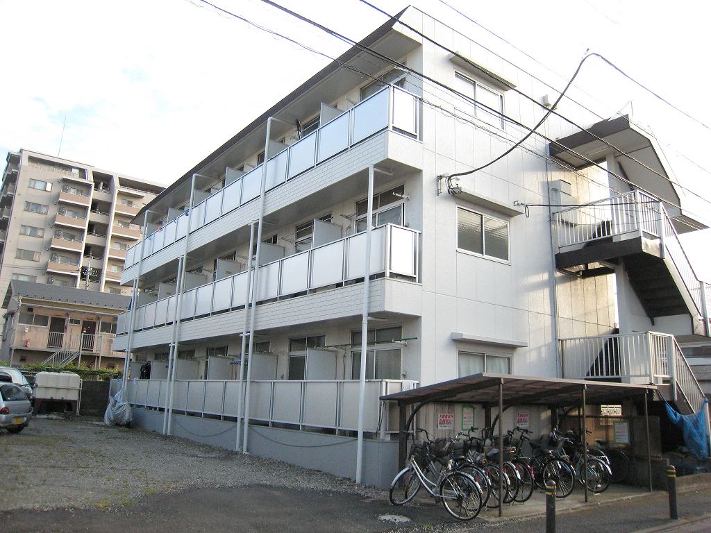 Building appearance. There is parking on the veranda side, There are clear. 