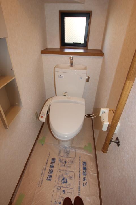 Toilet. Handrail is also considered to safety with toilet. Note also ventilation even with small window.