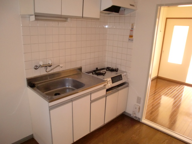 Kitchen. It is with a gas stove.