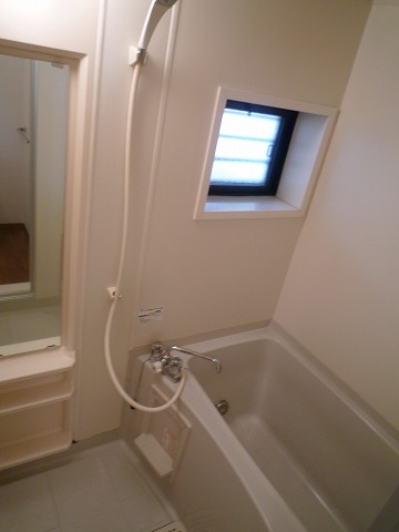 Bath. Bright bathroom of with window. It is with a course Reheating function