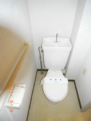 Toilet. There is also a wall outlet