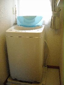 Washroom. With in-room washing machine