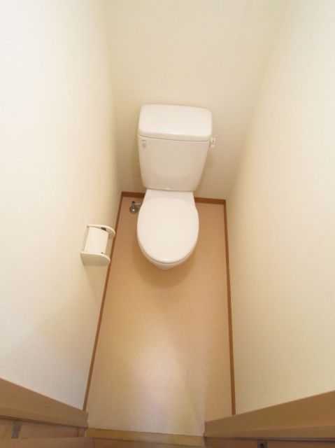 Toilet. It does not hit the knee to the door in a long human foot.