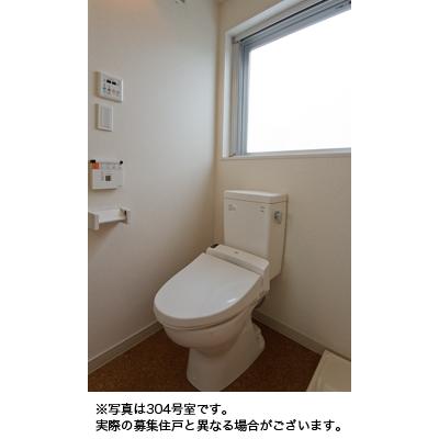 Toilet. The photograph is a reference photograph of 304, Room.