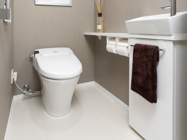 Toilet.  [Tankless toilet] Compact, hand-wash with a counter of simple design. It has adopted a tankless toilet that can produce a refreshing space.
