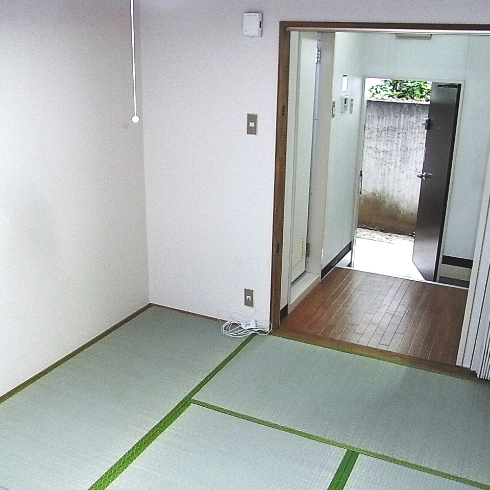 Other room space. Bathroom from the living room door and the front door