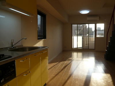 Living and room. Happily cooking in the large kitchen